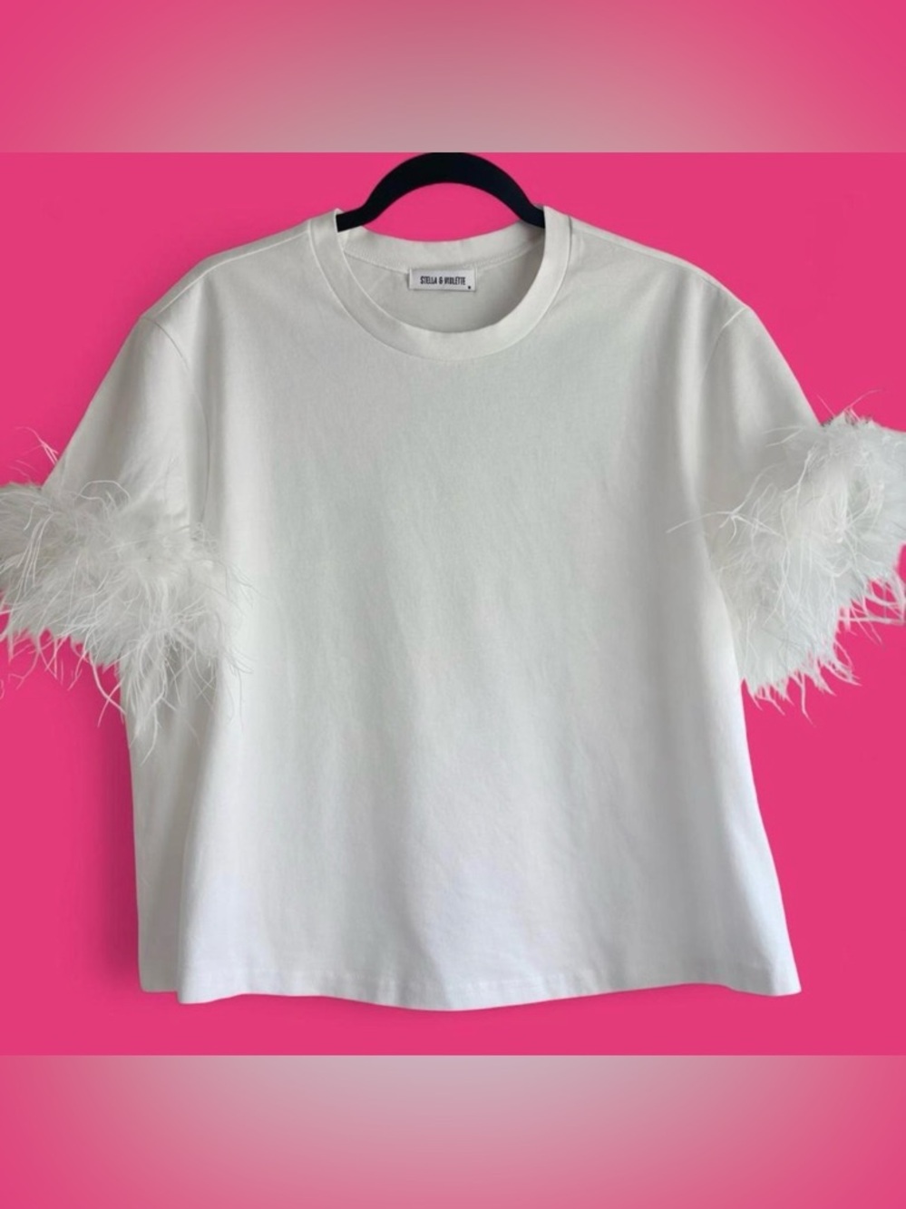 NWOT white top with feather trimmed sleeves
